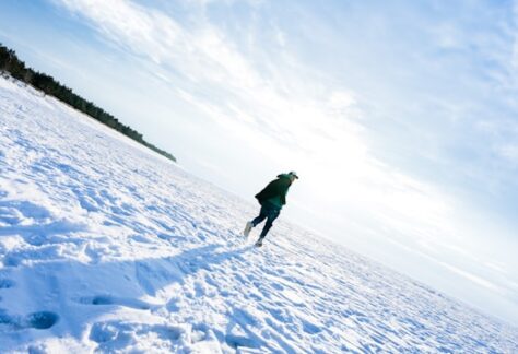 man running in the snow