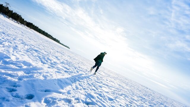 man running in the snow